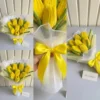 Handmade yellow tulip bouquet wrapped with satin ribbon